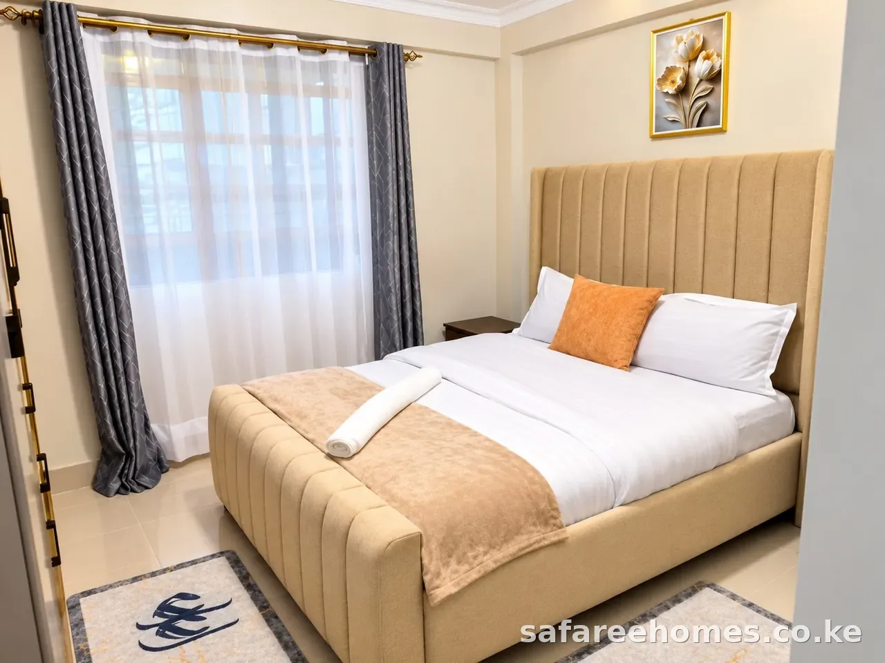 Calm queen bedroom with tufted headboard in a Nairobi holiday home